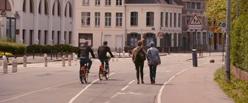 Movie still from “Blue Is the Warmest Colour” (2013), directed by Abdellatif Kechiche – A group of people walking down a street on bikes; Wide shot, High angle