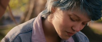 Movie still from “Blue Is the Warmest Colour” (2013), directed by Abdellatif Kechiche – A person with blue hair; Close Up shot, Over the shoulder angle