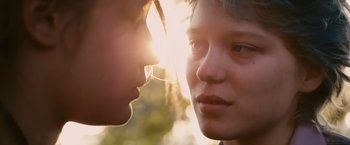 Movie still from “Blue Is the Warmest Colour” (2013), directed by Abdellatif Kechiche – Two young people looking into each other's eyes; Close Up shot, Over the shoulder angle