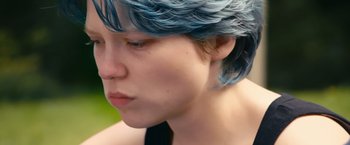 Movie still from “Blue Is the Warmest Colour” (2013), directed by Abdellatif Kechiche – A person with blue hair; Close Up shot, Over the shoulder angle