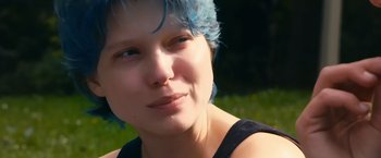 Movie still from “Blue Is the Warmest Colour” (2013), directed by Abdellatif Kechiche – A person with blue hair; Close Up shot, Over the shoulder angle