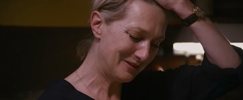 Movie still from “Blue Is the Warmest Colour” (2013), directed by Abdellatif Kechiche – A woman's face with her hand on her head; Close Up shot, Over the shoulder angle