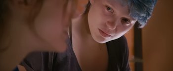 Movie still from “Blue Is the Warmest Colour” (2013), directed by Abdellatif Kechiche – A woman's face with her eyes wide open; Close Up shot, Over the shoulder angle
