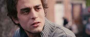 Movie still from “Blue Is the Warmest Colour” (2013), directed by Abdellatif Kechiche – A person wearing a sweater; Close Up shot, Low angle