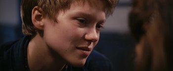 Movie still from “Blue Is the Warmest Colour” (2013), directed by Abdellatif Kechiche – A young man's face; Close Up shot, Over the shoulder angle