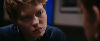 Movie still from “Blue Is the Warmest Colour” (2013), directed by Abdellatif Kechiche – A young man's face; Close Up shot, Over the shoulder angle