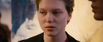 Movie still from “Blue Is the Warmest Colour” (2013), directed by Abdellatif Kechiche – A person with short hair; Close Up shot, Over the shoulder angle