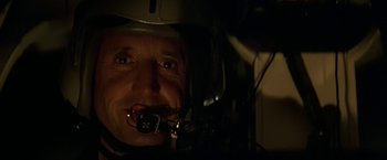 Movie still from “Blue Thunder” (1983), directed by John Badham – A person wearing a helmet; Close Up shot, Low angle