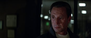 Movie still from “Blue Thunder” (1983), directed by John Badham – A person wearing a jacket; Close Up shot, Low angle