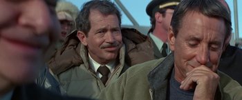 Movie still from “Blue Thunder” (1983), directed by John Badham – An older man wearing a jacket and a tie; Close Up shot, Over the shoulder angle
