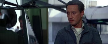 Movie still from “Blue Thunder” (1983), directed by John Badham – A person wearing a jacket; Close Up shot, Low angle