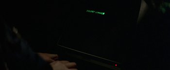 Movie still from “Blue Thunder” (1983), directed by John Badham – A computer screen that is lit up in the dark; Extreme Close Up shot, High angle