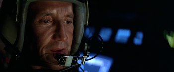 Movie still from “Blue Thunder” (1983), directed by John Badham – A person wearing a helmet and glasses; Close Up shot, Low angle