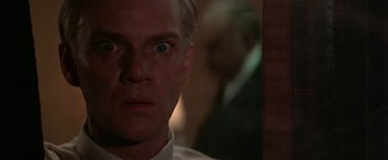 Movie still from “Blue Thunder” (1983), directed by John Badham – A person with his eyes wide open; Close Up shot, Low angle