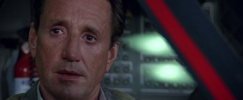 Movie still from “Blue Thunder” (1983), directed by John Badham – A man's face in front of an electrical panel; Close Up shot, Low angle