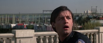 Movie still from “Blue Thunder” (1983), directed by John Badham – A person looking up at the sky; Close Up shot, Low angle