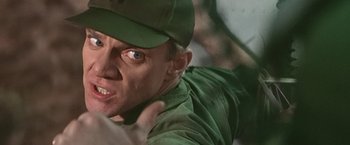 Movie still from “Blue Thunder” (1983), directed by John Badham – A person wearing a hat; Close Up shot, Low angle