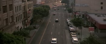 Movie still from “Blue Thunder” (1983), directed by John Badham – Cars driving down a street in a city; Extreme Wide shot, High angle