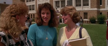 Movie still from “Blue Velvet” (1986), directed by David Lynch – Two young women standing next to each other on the grass; Medium shot, Over the shoulder angle