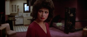 Movie still from “Blue Velvet” (1986), directed by David Lynch – A person wearing a red shirt; Close Up shot, Over the shoulder angle