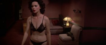 Movie still from “Blue Velvet” (1986), directed by David Lynch – A woman in a bra and panties in a living room; Medium shot, High angle