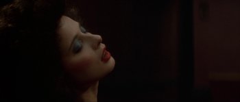 Movie still from “Blue Velvet” (1986), directed by David Lynch – A person with makeup on; Close Up shot, Overhead angle