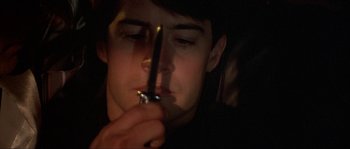 Movie still from “Blue Velvet” (1986), directed by David Lynch – A young man holding a knife in his hand; Close Up shot, High angle