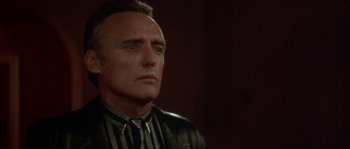 Movie still from “Blue Velvet” (1986), directed by David Lynch – A person wearing a jacket; Close Up shot, Over the shoulder angle