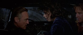 Movie still from “Blue Velvet” (1986), directed by David Lynch – A man and a woman talking in a car; Close Up shot, Over the shoulder angle