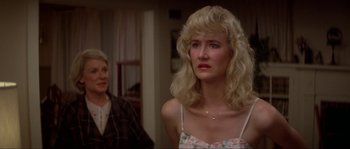 Movie still from “Blue Velvet” (1986), directed by David Lynch – A woman with blonde hair is looking at a man; Close Up shot, Over the shoulder angle