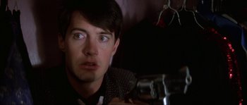 Movie still from “Blue Velvet” (1986), directed by David Lynch – A person looking at the camera; Close Up shot, Over the shoulder angle
