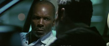 Movie still from “Boarding Gate” (2007), directed by Olivier Assayas – A man looking at himself in the mirror; Close Up shot, Over the shoulder angle
