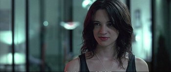 Movie still from “Boarding Gate” (2007), directed by Olivier Assayas – A person wearing a necklace; Close Up shot, Low angle