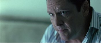 Movie still from “Boarding Gate” (2007), directed by Olivier Assayas – A person with green eyes; Close Up shot, Over the shoulder angle