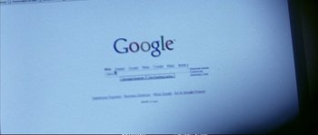 Movie still from “Boarding Gate” (2007), directed by Olivier Assayas – A computer screen with a google logo on it; Extreme Close Up shot, Low angle