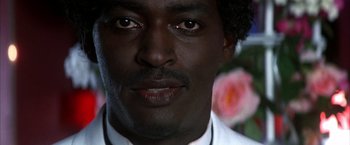 Movie still from “Boogie Nights” (1997), directed by Paul Thomas Anderson – A man's eyes and face; Close Up shot, Low angle