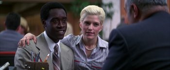 Movie still from “Boogie Nights” (1997), directed by Paul Thomas Anderson – A man and a woman posing for a picture; Close Up shot, Over the shoulder angle