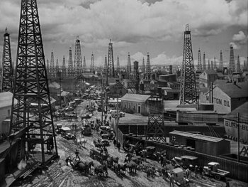Movie still from “Boom Town” (1940), directed by Jack Conway – An old photo of an oil field in the 1 9 3 0's; Extreme Wide shot, High angle