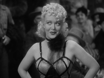 Movie still from “Boom Town” (1940), directed by Jack Conway – A black and white photo of a woman in lingerie; Close Up shot, Over the shoulder angle