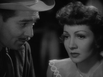 Movie still from “Boom Town” (1940), directed by Jack Conway – A man and a woman looking at one another; Close Up shot, Over the shoulder angle