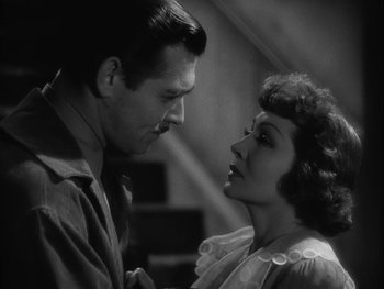 Movie still from “Boom Town” (1940), directed by Jack Conway – A man and a woman looking at one another; Close Up shot, Over the shoulder angle