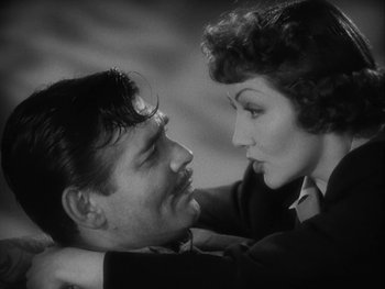 Movie still from “Boom Town” (1940), directed by Jack Conway – A man and a woman looking into each others eyes; Close Up shot, High angle