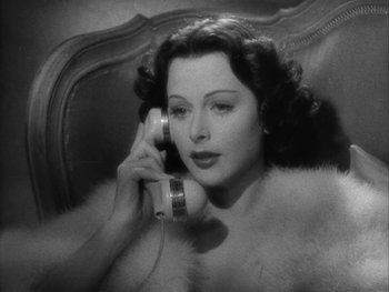 Movie still from “Boom Town” (1940), directed by Jack Conway – An old photo of a woman talking on a phone; Close Up shot, High angle