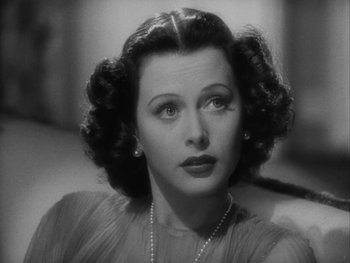 Movie still from “Boom Town” (1940), directed by Jack Conway – An old black and white photo of a woman; Close Up shot, High angle