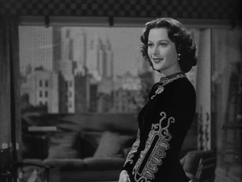Movie still from “Boom Town” (1940), directed by Jack Conway – A black and white photo of a woman in a black dress; Medium shot, Low angle
