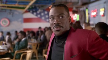 Movie still from “Boomerang” (1992), directed by Reginald Hudlin – A person wearing a jacket; Close Up shot, Over the shoulder angle
