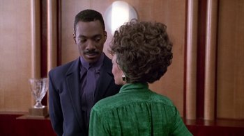 Movie still from “Boomerang” (1992), directed by Reginald Hudlin – A man and a woman talking to each other; Medium shot, Over the shoulder angle