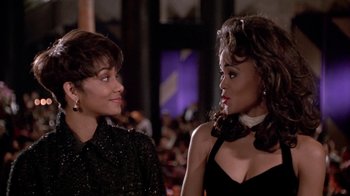 Movie still from “Boomerang” (1992), directed by Reginald Hudlin – Two women are talking to each other at a party; Close Up shot, Over the shoulder angle
