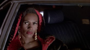 Movie still from “Boomerang” (1992), directed by Reginald Hudlin – A woman sitting in the back seat of a car; Close Up shot, Over the shoulder angle