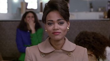 Movie still from “Boomerang” (1992), directed by Reginald Hudlin – A person wearing a coat; Close Up shot, Over the shoulder angle